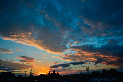 Low angle view of dramatic sky during sunset