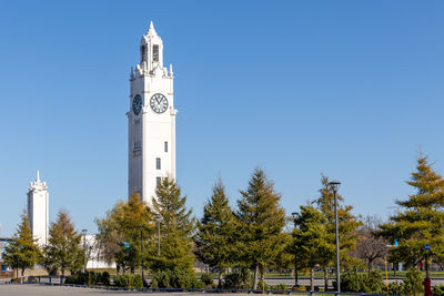 Low angle view of building against clear blue sky