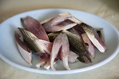 Close-up of sliced raw fish on plate