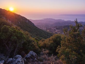 Scenic view of mountains against sky during sunset