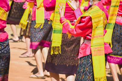 Group of people dancing on street