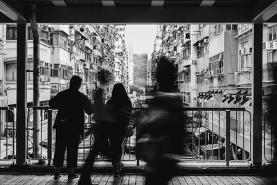 People walking in corridor of building