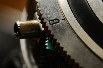 Close-up of machine part on table