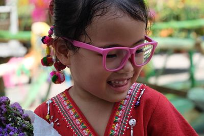 Cute girl in traditional clothing outdoors