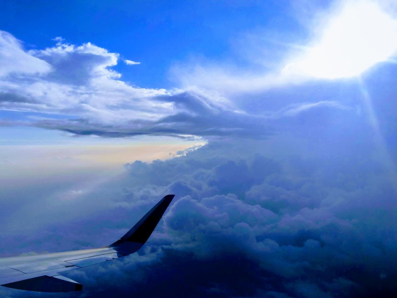 AERIAL VIEW OF CLOUDSCAPE OVER AIRPLANE