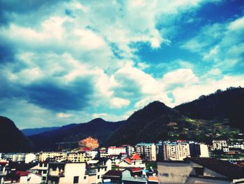 Town against cloudy sky