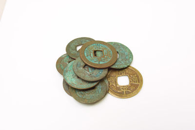 Close-up of coins on white background