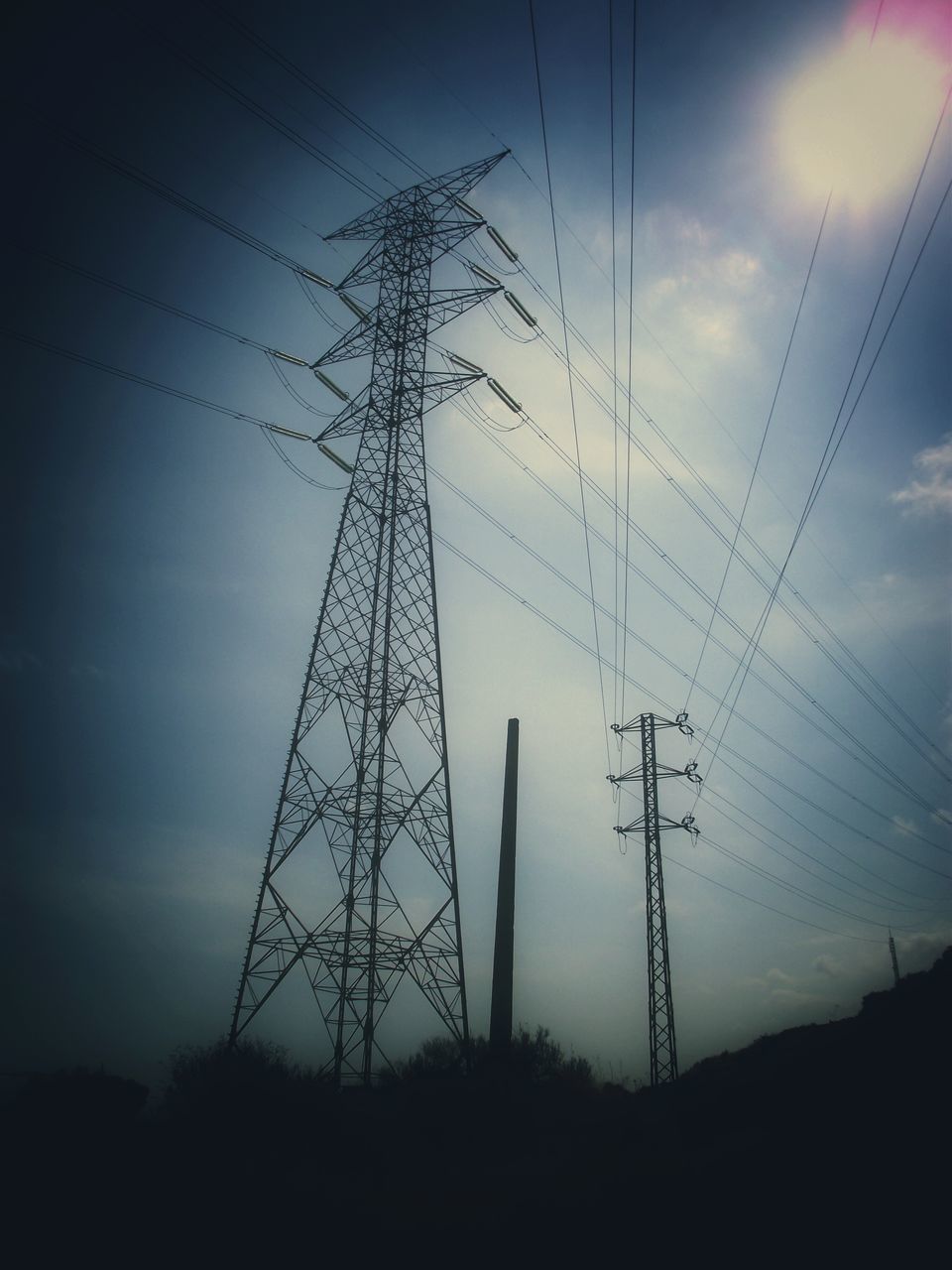 electricity pylon, power line, power supply, fuel and power generation, electricity, connection, technology, silhouette, low angle view, cable, sky, sunset, power cable, dusk, nature, tranquility, electricity tower, cloud - sky, outdoors, no people