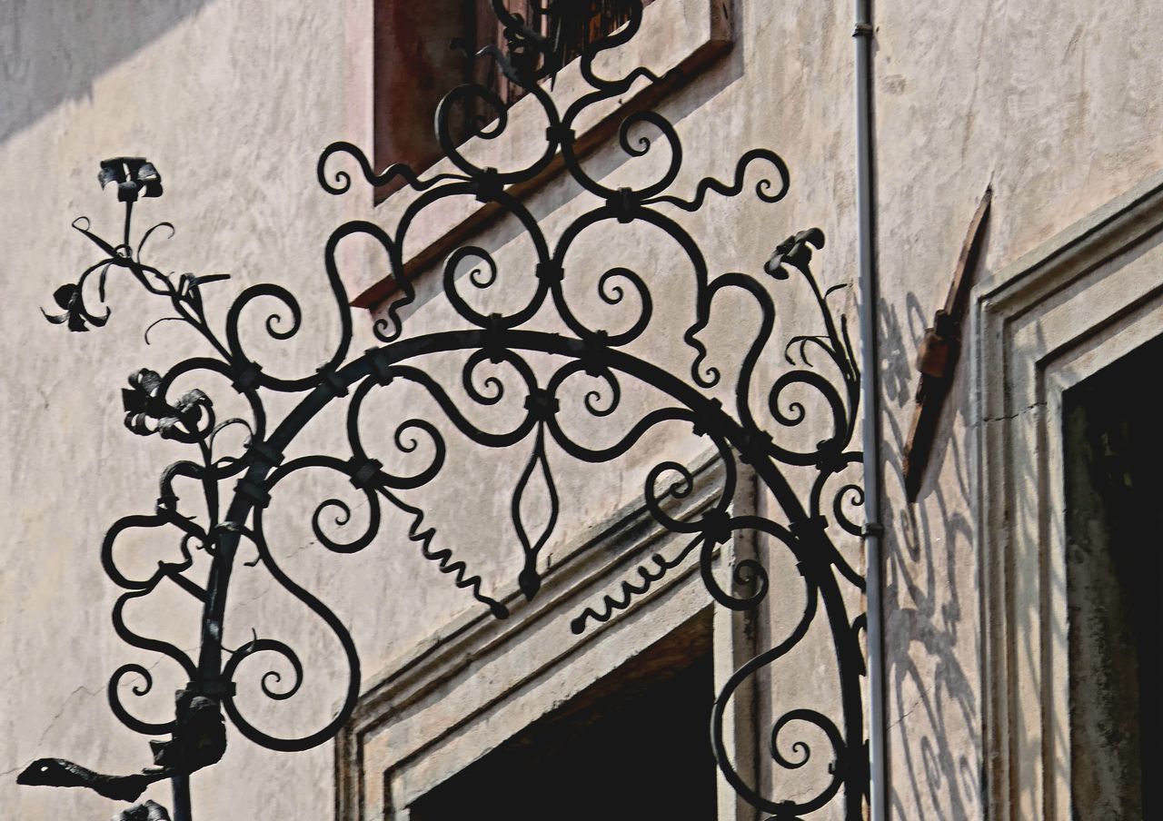iron, architecture, built structure, building exterior, wrought iron, no people, building, entrance, gate, wall, door, ornate, pattern, wall - building feature, day, metal, residential district, railing, house, outdoors, window, close-up, staircase, city