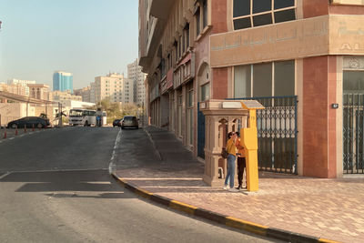 Rear view of woman walking on street