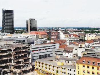 High angle view of buildings in city against sky