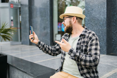 Young man using mobile phone