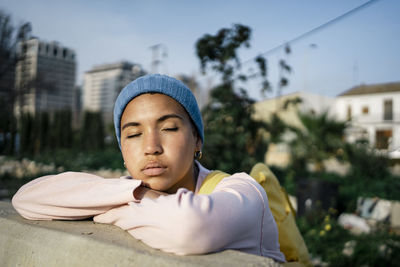 Portrait of mid adult man relaxing in city