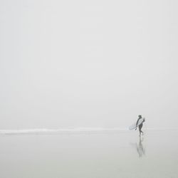 Woman jumping in sea