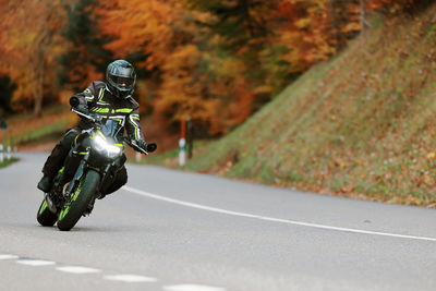 Man riding motorcycle on road