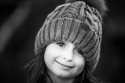 Close-up portrait of cute girl in knit hat