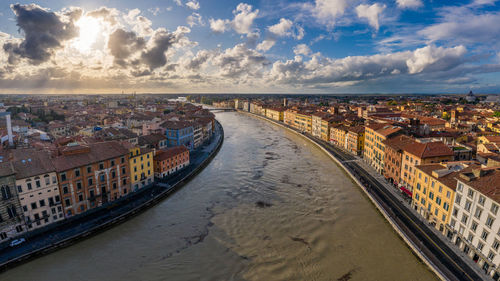 High angle view of townscape by canal in city