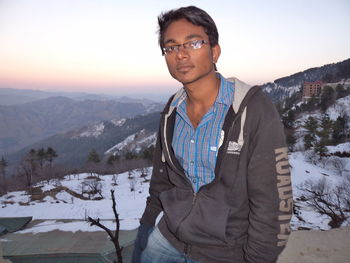 Portrait of man in mountains against sky