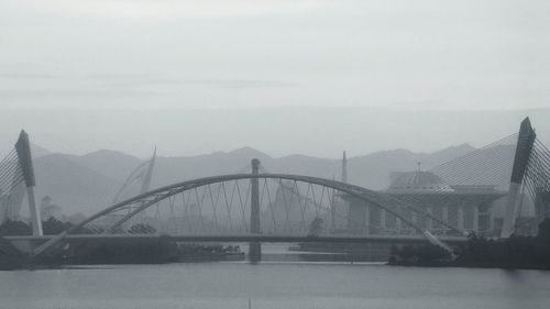 View of buildings in foggy weather