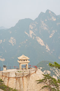 Built structure on mountain against sky