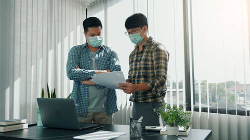 People working on table at home