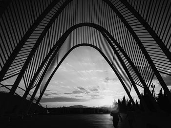 Silhouette bridge against sky