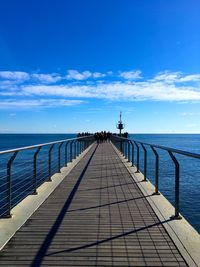 Pier over sea against sky