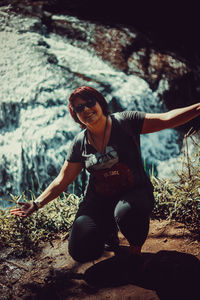 Young woman sitting on a land