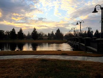 Scenic view of river against sky at dusk