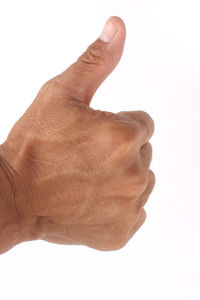 Close-up of human hand against white background