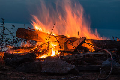 Bonfire against orange sky