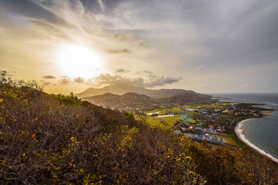 Scenic view of cityscape against sky during sunset