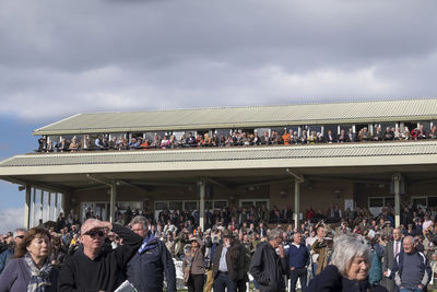 People in traditional clothing against sky