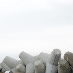 Close-up of stacked stack against clear sky
