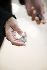 Womans hand holding stone