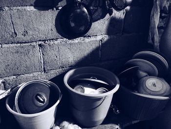 Close up of pots against brick wall