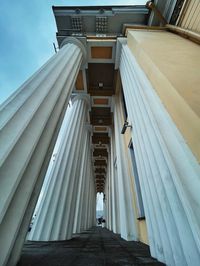 Low angle view of steps amidst buildings