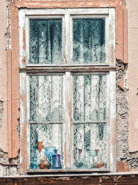 Low angle view of window on old building