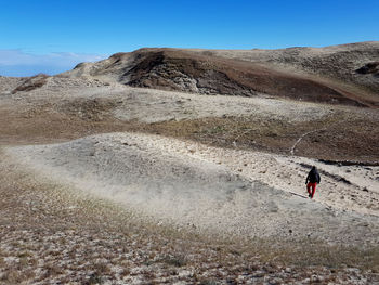 Scenic view of arid landscape against sky