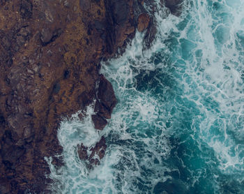 High angle view of rock formation in sea