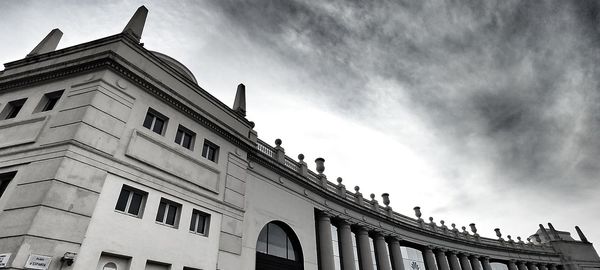 Low angle view of building against cloudy sky