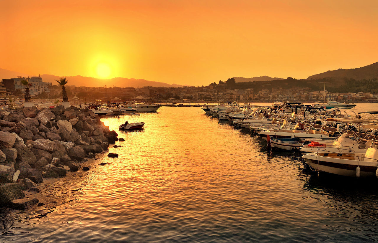 SCENIC VIEW OF SEA AGAINST ORANGE SKY