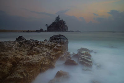 Scenic view of sea against sky at sunset