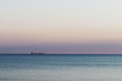 Scenic view of sea against sky at sunset