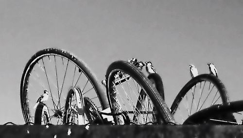 Low angle view of ferris wheel against sky