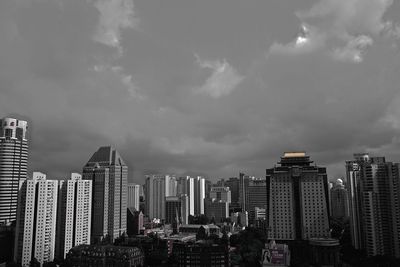 Modern buildings in city against sky