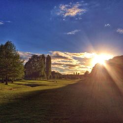 Scenic view of landscape against sky at sunset