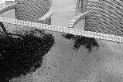 Reflection of building in puddle