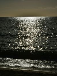 Scenic view of sea against sky at sunset