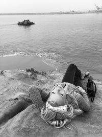 High angle view of woman lying at beach